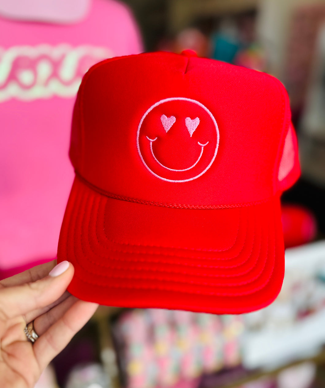 The Smiley Heart Trucker Hat in Red